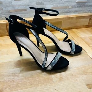 Black heels with sparkly straps.